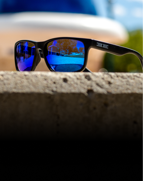 photochromic murphy sunglasses laying on concrete ledge
